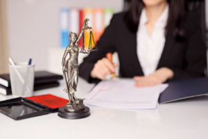Statuette of Themis - goddess of justice on lawyer's desk