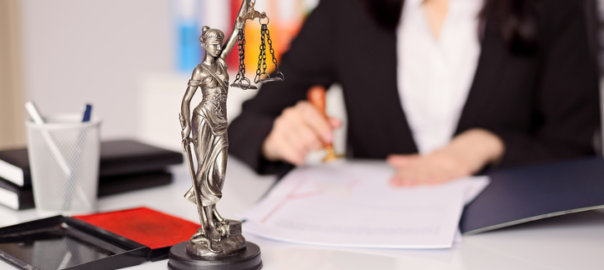 Statuette of Themis - goddess of justice on lawyer's desk